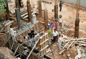 Cement being carried and poured into forms for construction of a typical house in Vasantnagar, Bangalore