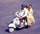 A picture of a family on a motor scooter in Bangalore.